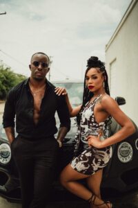 Male model Emanuel Jones, Jr. and a female model sitting in a Bentley Bentayga for a photo-shoot in Dallas, Texas.