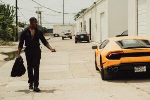 Male model Emanuel Jones, Jr. photographed with a female model and yellow Lamborghini for a photo-shoot in Dallas, Texas.